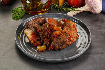 Baked beef ribs with vegetables