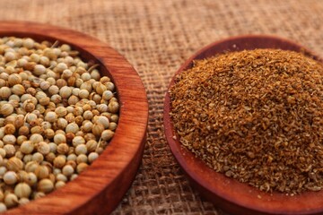 Forms of Coriander Seeds (Coriandrum sativum) and ground coriander with close view.