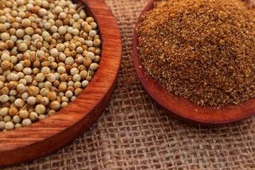 Forms of Coriander Seeds (Coriandrum sativum) and ground coriander with close view.