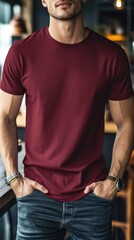 A man wearing dark red color t shirt mockup; with bracelet; at the cafe; front view