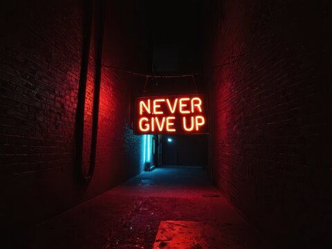  a vibrant neon message illuminates a shadowy alleyway encouraging perseverance