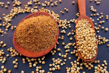 Forms of Coriander Seeds (Coriandrum sativum) and ground coriander with close view.