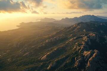 Obraz premium Natural landscape of rocky hills during sunrise, with a panoramic view across the terrain.