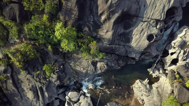 Aerial drone shot descending from above, revealing the breathtaking landscapes of Vale da Lua in Chapada dos Veadeiros, Brazil