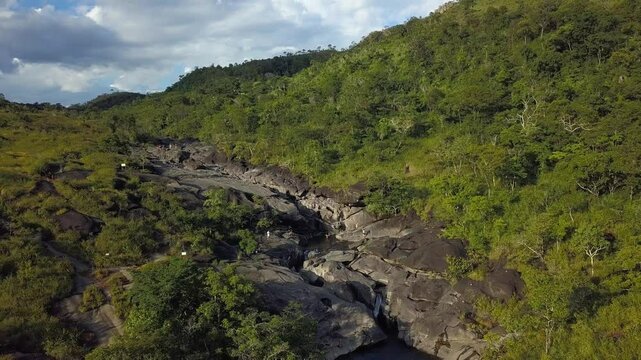 Aerial drone shot flying away to reveal the vast scale and untouched natural beauty of Vale da Lua, Chapada dos Veadeiros, Brazil