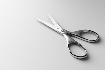 Stainless Steel Scissors with Sharp Blades Resting on a Soft Gray Canvas.