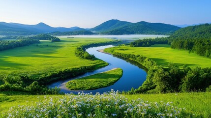 Obraz premium Serene River Winding Through Lush Green Valley And Mountains
