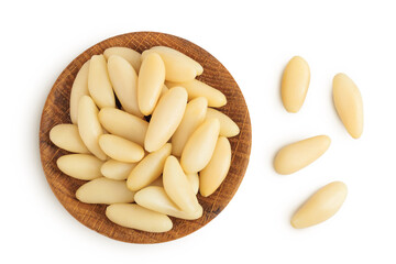 Shelled European pine nuts in wooden bowl isolated on white background with full depth of field. Top view. Flat lay