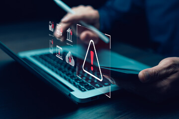 programmer using laptop with triangle caution warning sign for notification error system , hacker...