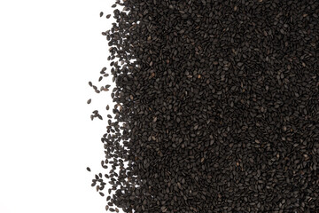 Pile of black sesame seeds isolated on white background