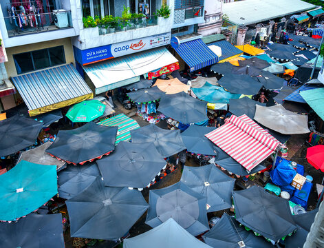 Ho Chi Minh city, Vietnam - February 4th, 2025: Beautiful daily life of traditional market at Phung Hung street, Cho Lon, Saigon in early morning.