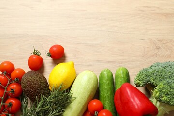 Clean healthy eating habits concept. Fruits, herbs, greens and vegetables mix, colorful juicy organic detox smoothie juice ingredients, wooden background. Vegan vegetarian diet food