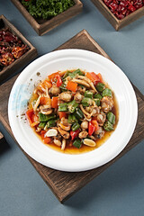 Braised scallops with bell pepper, okra, seafood and mushrooms