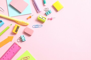Flat lay with school stationery on pink background, top view