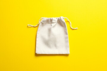 Small eco sack on color background. Top view.