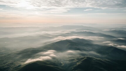 Obraz premium Aerial view Sunrise over misty mountain range