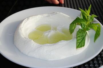 Delicious traditional labneh served with olive oil and fresh mint at the Dead Sea in Jordan