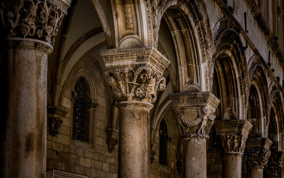 Intricately Designed Stone Column and Archway Structure in Historic Building Interior