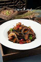 Stir-fried scallops with spicy sauce and melon