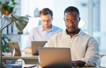 Laptop, business and man in office, planning for article and report for sports news Journalist,...
