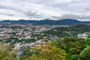 Panoramic nature background of the landscape with views of mountains, sea, trees and fishermen's houses. The beauty of the forest during the seasonal tourism season.