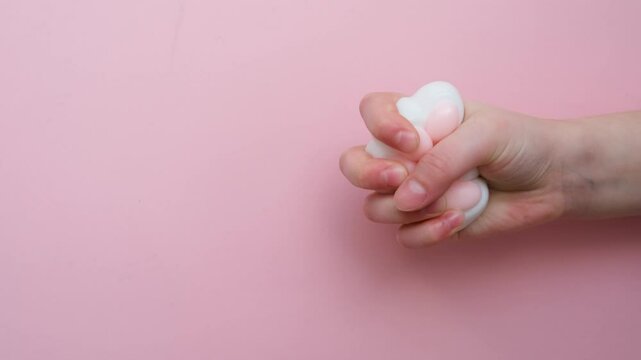 Taba paw pink and white colorful anti-stress toys squirt on baby's hand