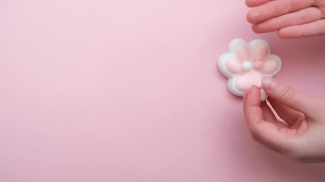 Taba paw pink and white colorful anti-stress toys squirt on baby's hand