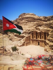 Explore the stunning Ad Deir Monastery at Petra, Jordan, showcasing ancient architecture against a desert backdrop
