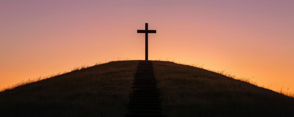 Silhouette Cross on Hill at Sunset