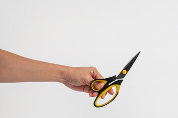 Office stationery scissors cutting in hand on white background