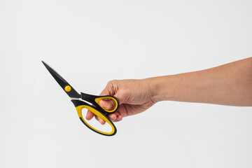 Office stationery scissors cutting in hand on white background