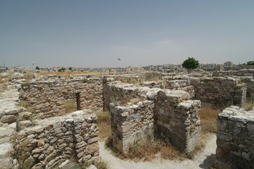 Exploring the ruins of the Umayyad Palace in Amman, Jordan, showcasing ancient architecture against...
