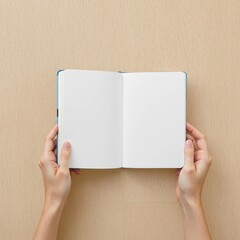Obraz premium A person is holding a book open to a blank page