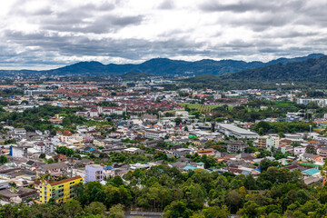 Fototapeta premium Panoramic nature background of the landscape with views of mountains, sea, trees and fishermen's houses. The beauty of the forest during the seasonal tourism season.