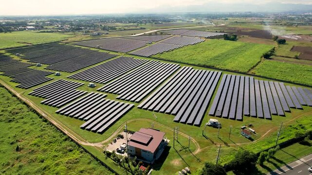Aerial flyby view of Raslag Solar Power Plant, Mexico, Pampanga, Philippines, along NLEX highway.