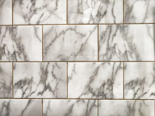 Elegant white marble tile pattern with subtle veining and grout lines for interior design projects
