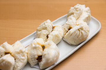 Steamed barbecue pork buns on dish