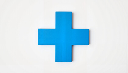 Obraz premium Blue medical cross on white background, hospital symbolism