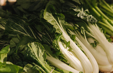 Fresh vegetables at small local urban market. Organic produce on sale at outdoor farmer market....