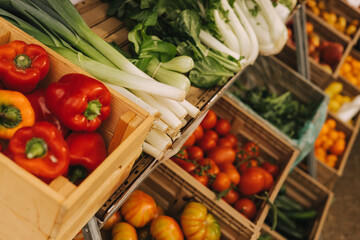 Fresh vegetables at small local urban market. Organic produce on sale at outdoor farmer market. Selling fresh crops and veggies harvest. European urban setting. Close up. Part of the series