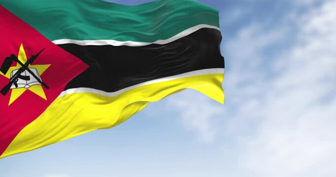 Close-up of Mozambique national flag waving on a clear day
