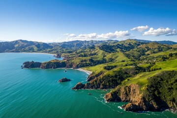 Coastal cliffs edge meets sea, green hills roll. Scenery for backgrounds