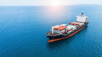 Cargo Ship Navigates Open Waters Transporting Goods in Bright Daylight With Containers Stacked on Deck