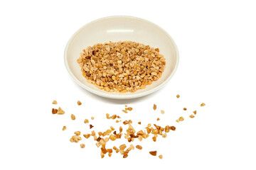 Crumbled Peanuts in a white bowl and scattered on isolated white background. Crushed Roasted Nuts,...