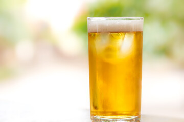 glass of beer on blur background