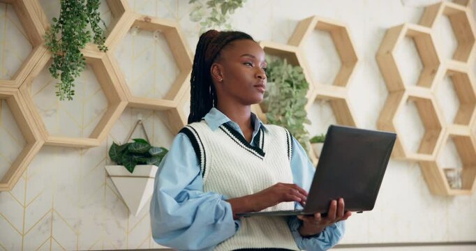 Booking, laptop and thinking with black woman concierge in hotel for hospitality or welcome. Computer, online reservation and reception with employee in lobby of luxury lodge or resort for tourism