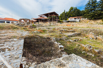 View of the archaeological site featuring an early Christian basilica amidst ancient ruins in...