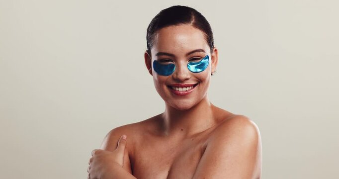 Studio, woman and face with eye patch for skincare, dermatology or facial product for dark circles. Mockup, female person and beauty in portrait for antiaging treatment, cosmetics or white background