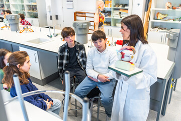 Teacher explaining human eye anatomy to students in science class