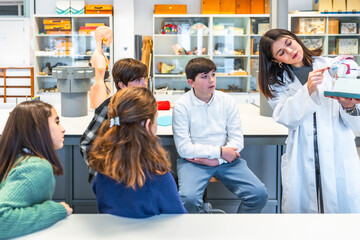 Teacher explaining anatomy to students in science class